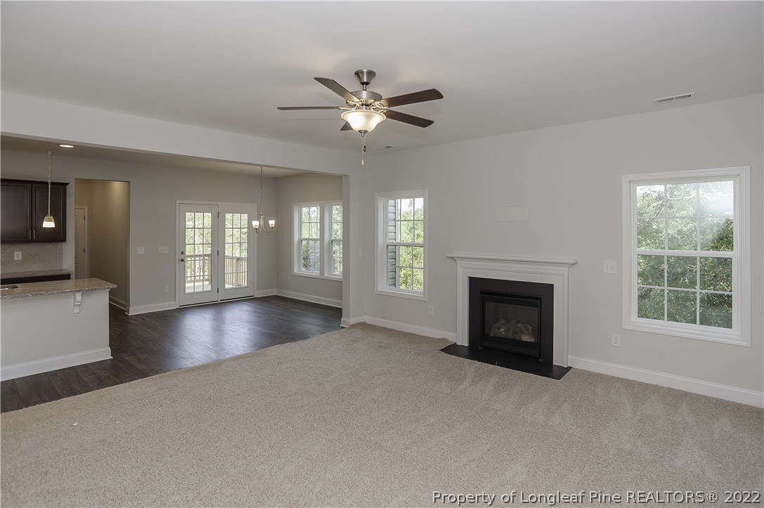 454 Pittfield Run Cameron, NC 28326 - Photo 10 of 37 a view of an empty room with window and fire place
