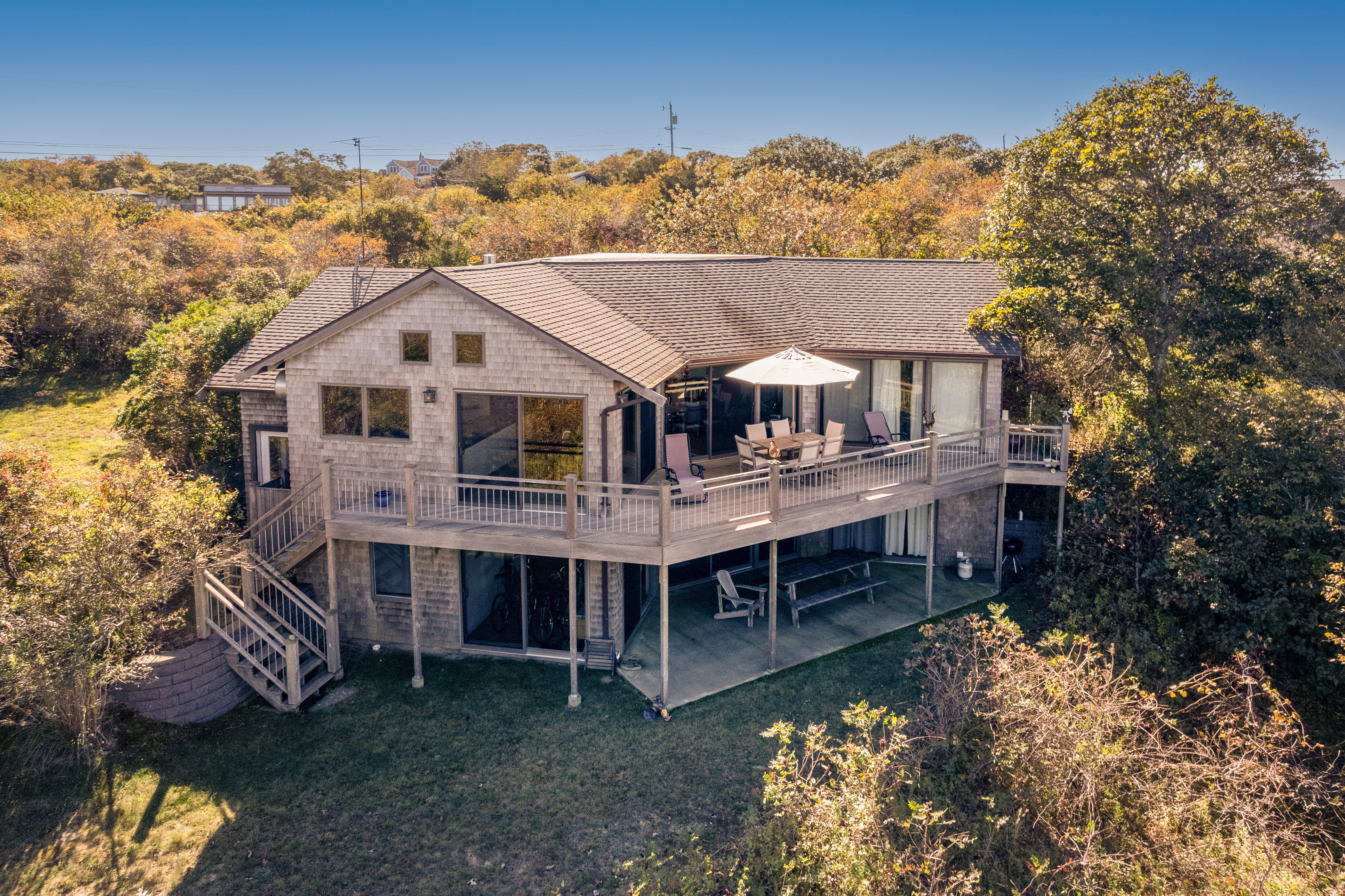 382 Lighthouse Road Aquinnah, MA 02535 - Photo 2 of 29 an aerial view of a house with a yard