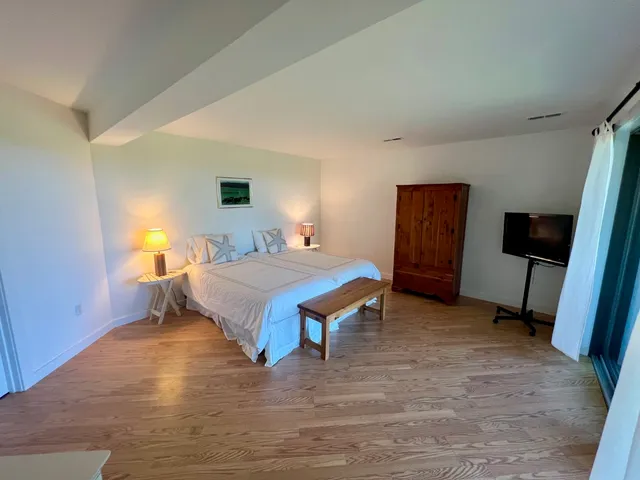 a bedroom with a bed and a view of bathroom