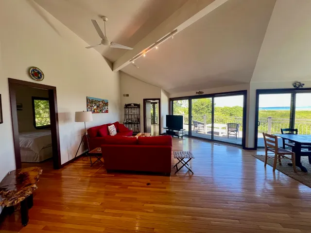 a living room with furniture window and wooden floor