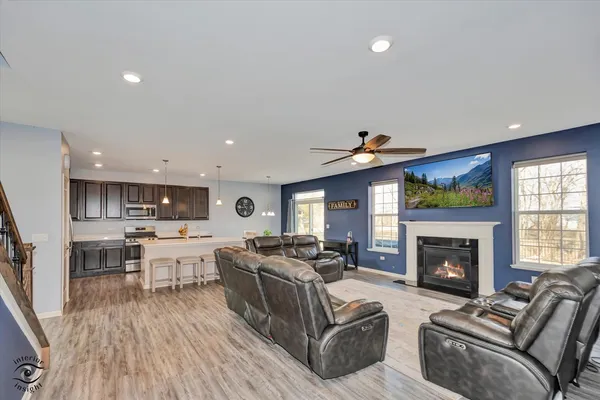 a living room with furniture fireplace and flat screen tv