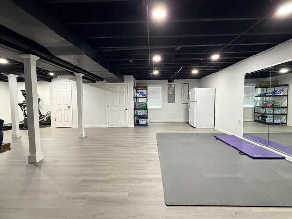 a view of work space with furniture and wooden floor