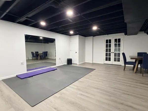 a bedroom with a bed and a chair