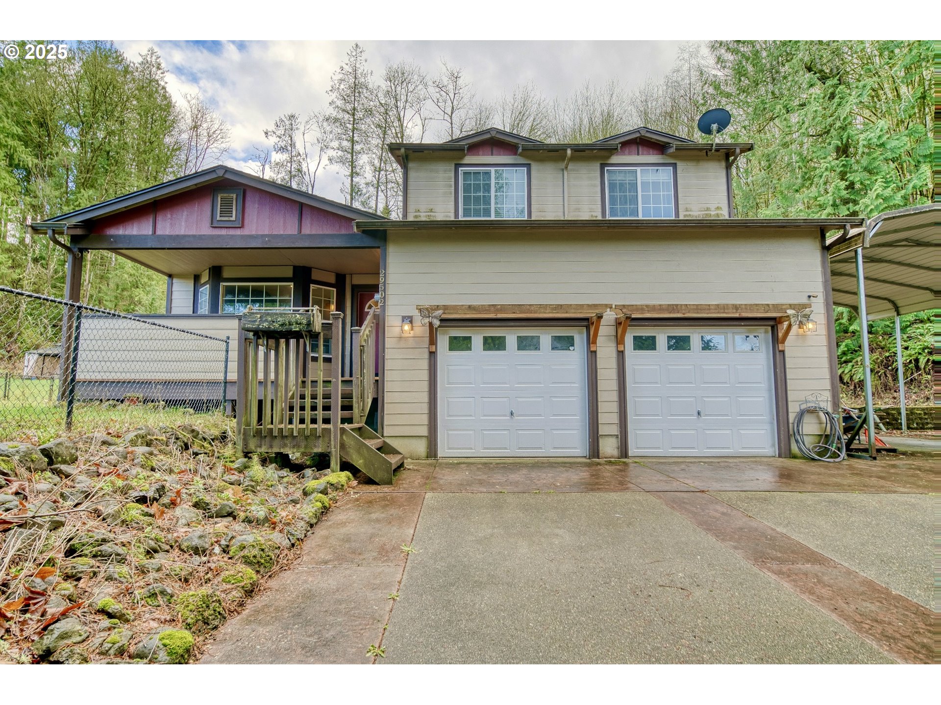 a view of a house with a yard and garage