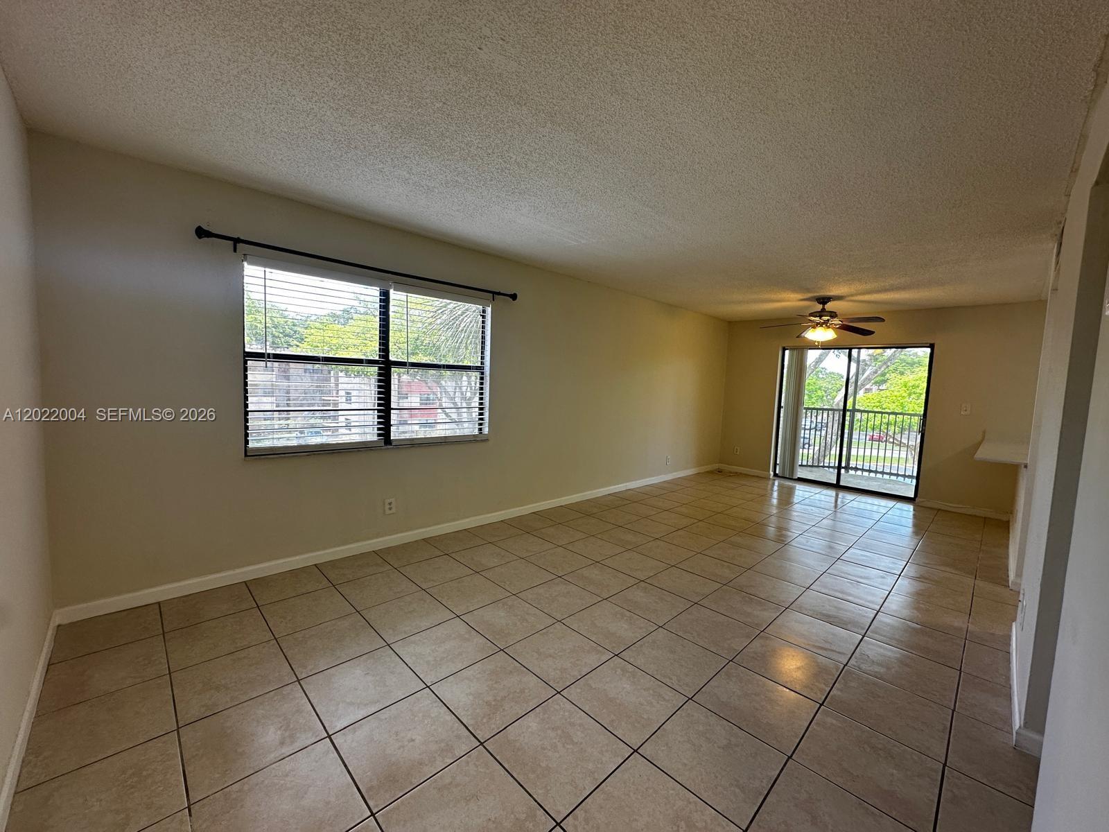 3400 Foxcroft Road, Unit 301 Miramar, FL 33025 - Photo 57 of 72 an empty room with windows and painted walls