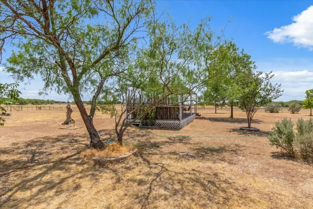 a view of backyard with outdoor space