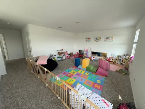 a bedroom with furniture and a window