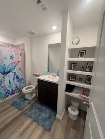 a room with furniture toys and a window