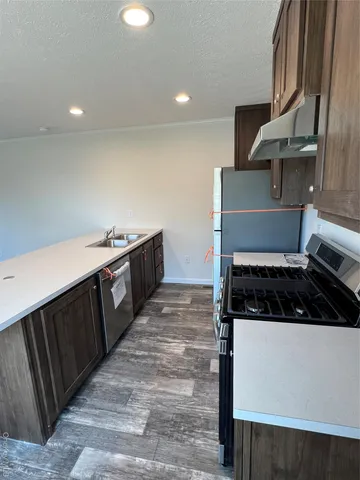 a kitchen with a stove and a sink