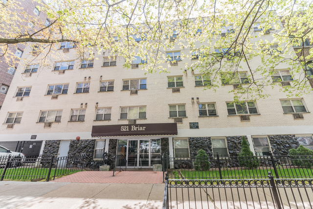 541 West Briar Place, Unit 307 Chicago, IL 60657 - Photo 1 of 10 front view of a building with a garden