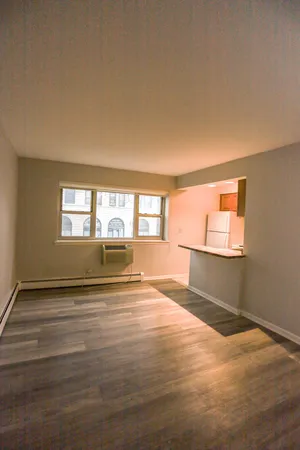 a view of an empty room with a window