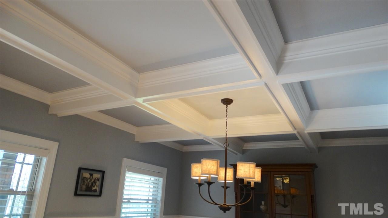 1308 Trinity Circle Raleigh, NC 27607 - Photo 7 of 25 A Coffered Ceiling and upgraded Chandelier grace the Classic Lines of this Inviting Dining Room.