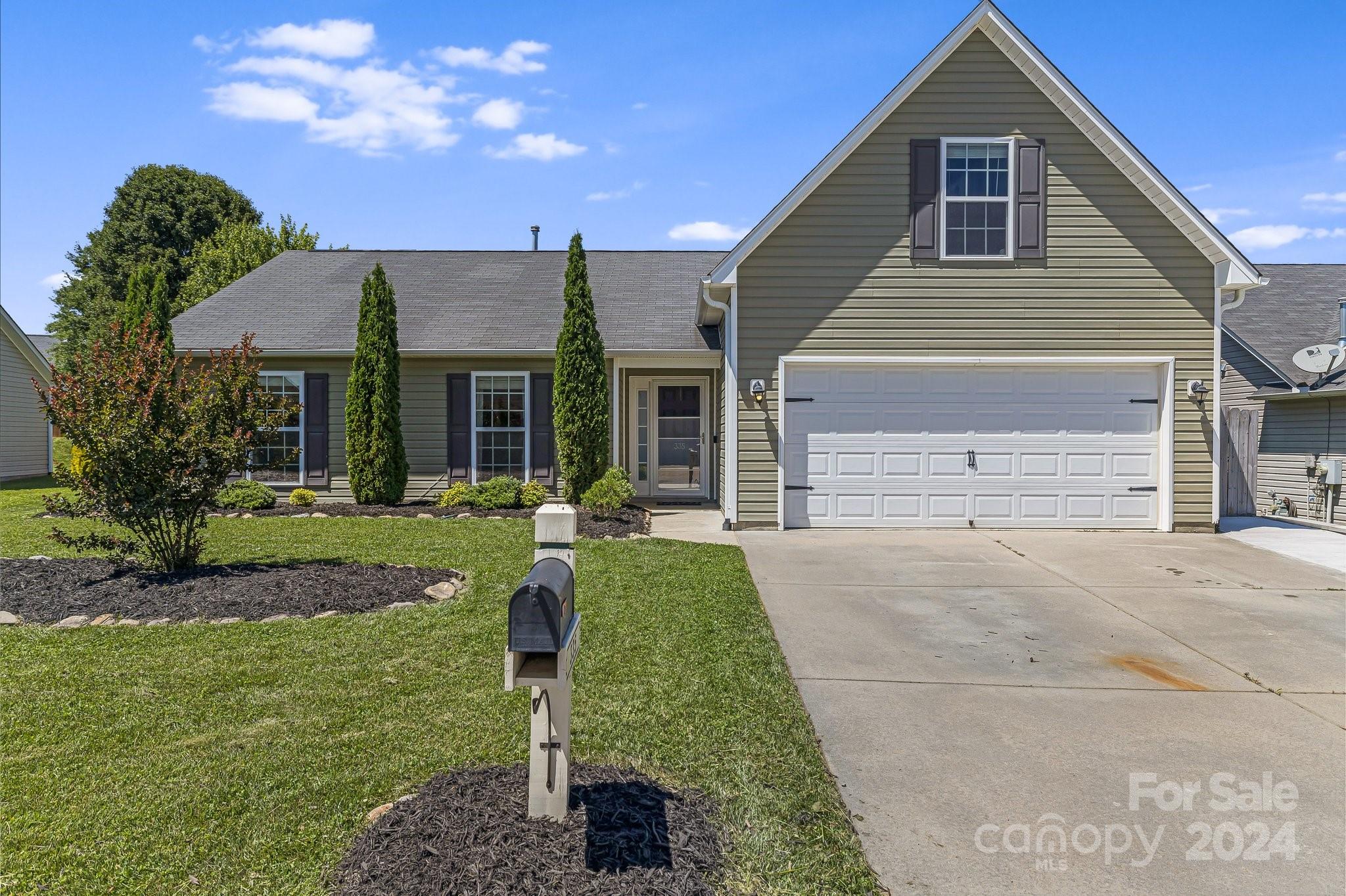 335 West Swift Creek Road Fletcher, NC 28732 - Photo 1 of 37 a front view of a house with a yard