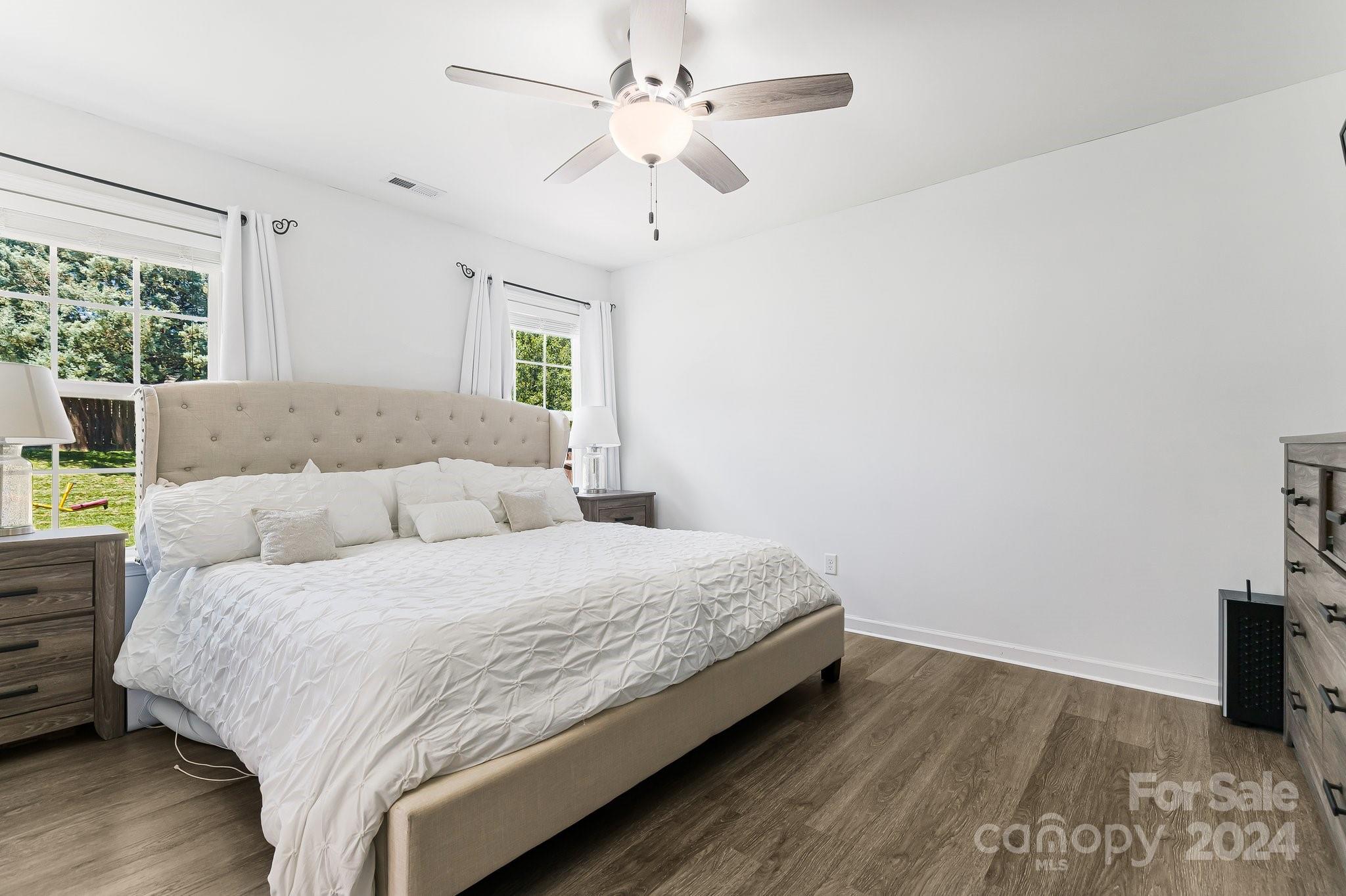 335 West Swift Creek Road Fletcher, NC 28732 - Photo 15 of 37 a bedroom with a bed and a window