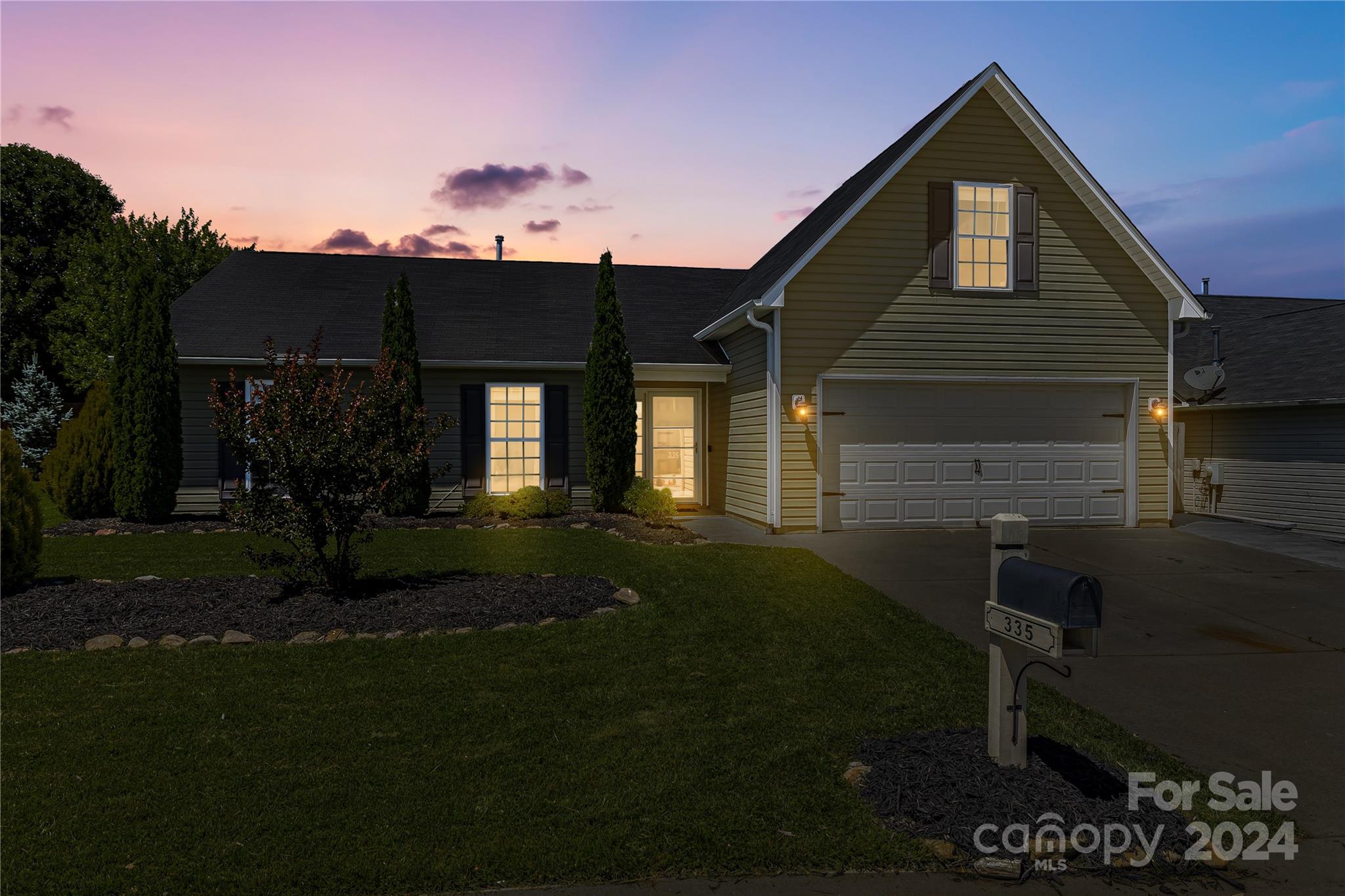 335 West Swift Creek Road Fletcher, NC 28732 - Photo 2 of 37 a front view of a house with garden