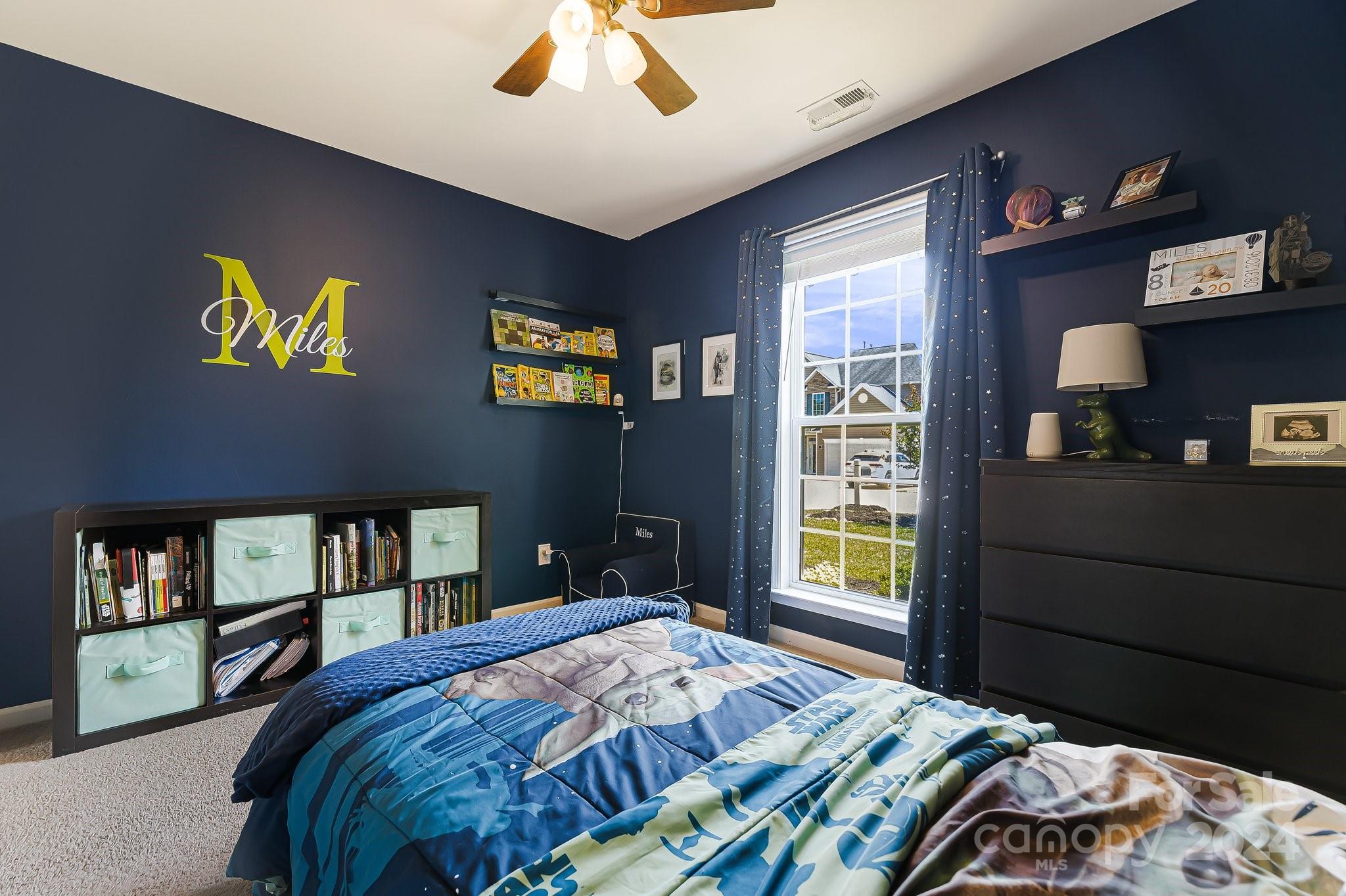 335 West Swift Creek Road Fletcher, NC 28732 - Photo 21 of 37 a bedroom with a bed and a window