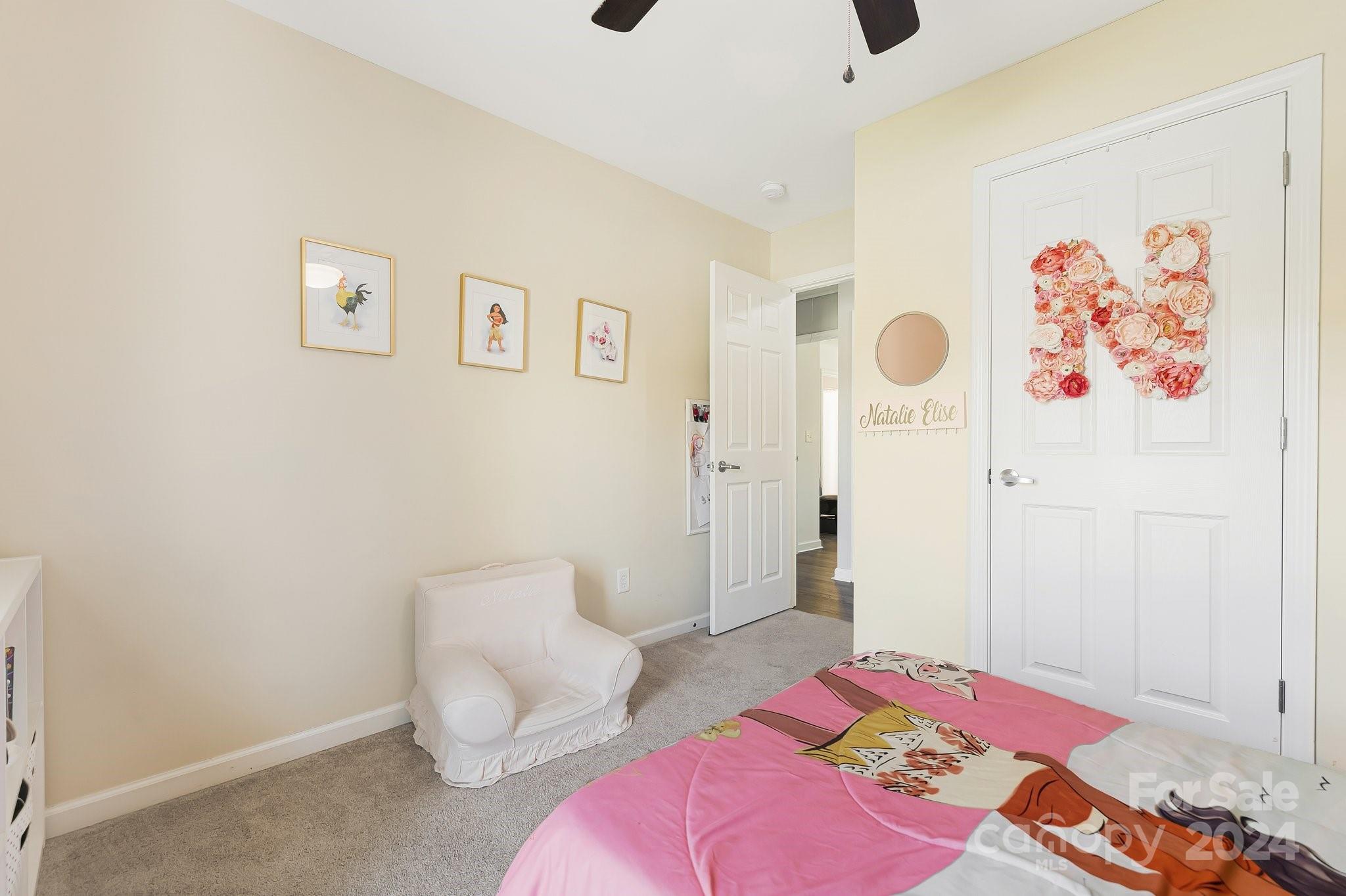 335 West Swift Creek Road Fletcher, NC 28732 - Photo 24 of 37 a bedroom with a bed and a couch