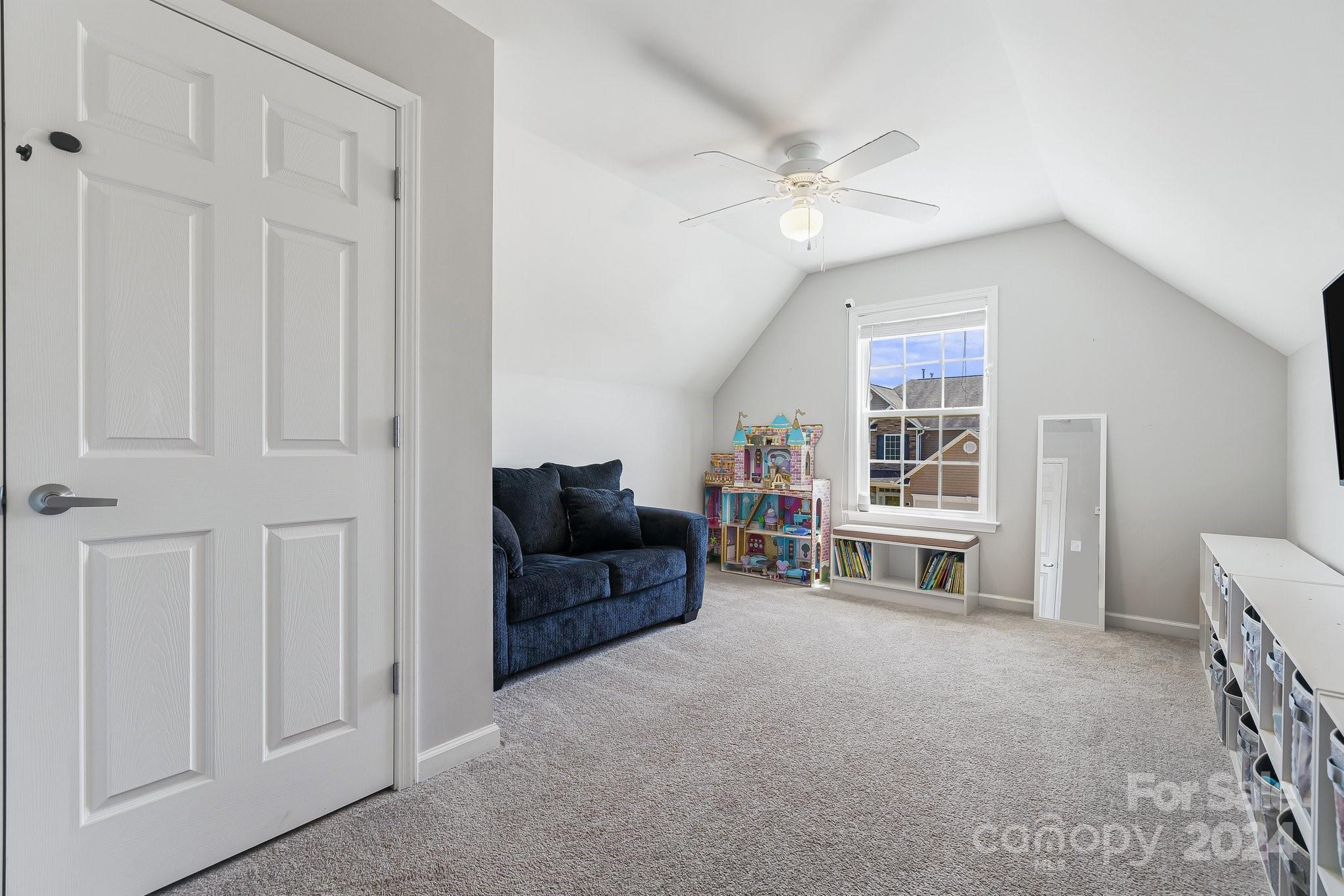 335 West Swift Creek Road Fletcher, NC 28732 - Photo 26 of 37 a living room with furniture and a ceiling fan