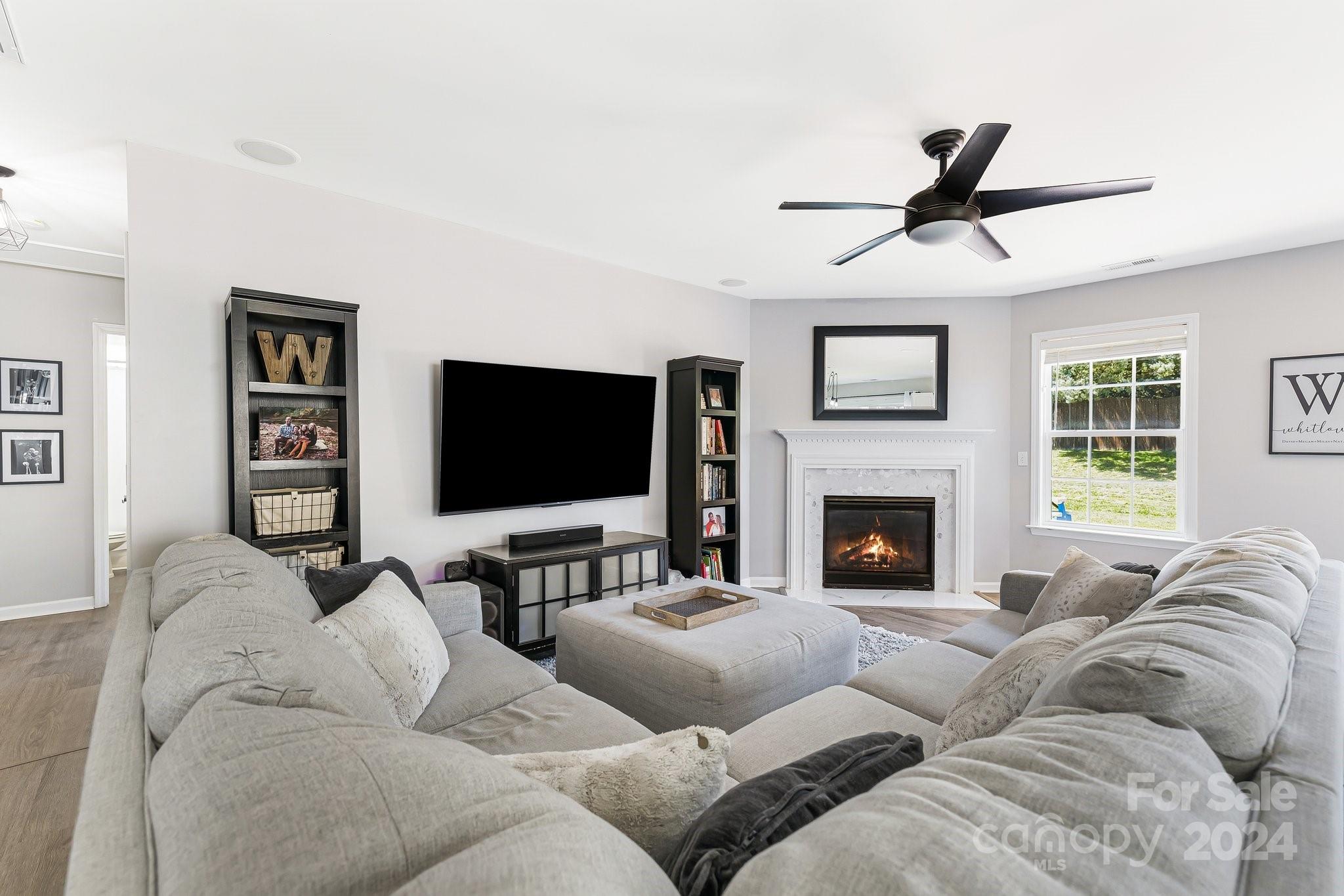 335 West Swift Creek Road Fletcher, NC 28732 - Photo 6 of 37 a living room with furniture and a flat screen tv