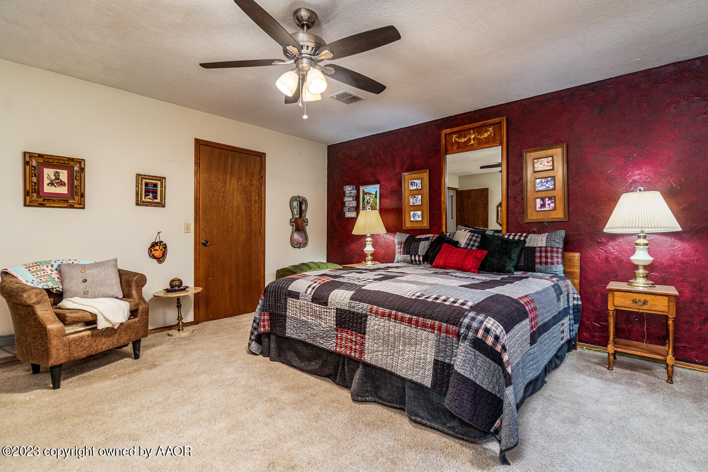 3406 Gladstone Lane Amarillo, TX 79121 - Photo 11 of 21 a bedroom with a bed and a chandelier