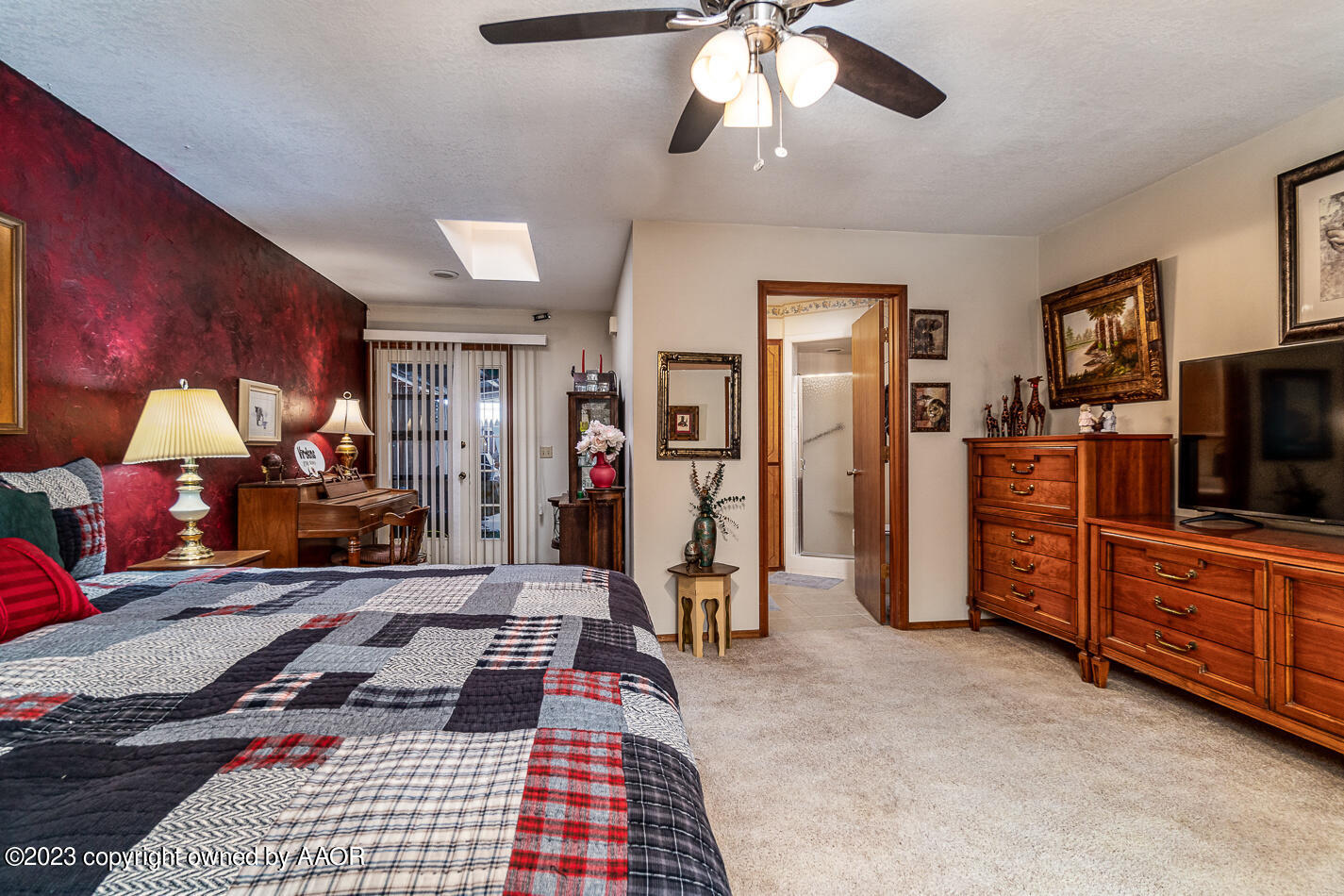 3406 Gladstone Lane Amarillo, TX 79121 - Photo 13 of 21 a bedroom with furniture and a flat screen tv
