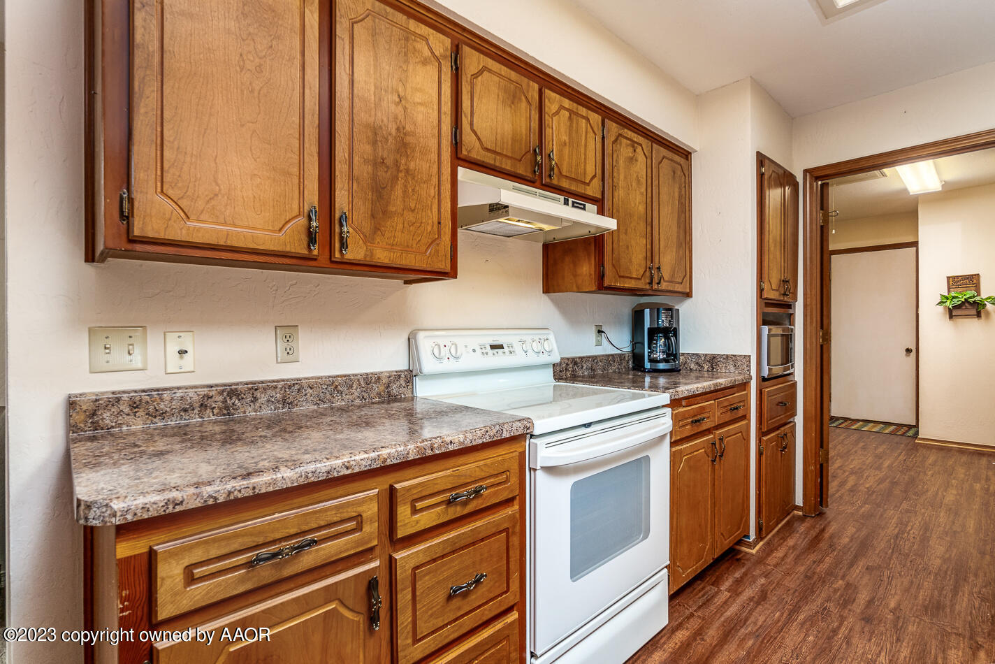 3406 Gladstone Lane Amarillo, TX 79121 - Photo 10 of 21 a kitchen with stainless steel appliances granite countertop a sink and cabinets