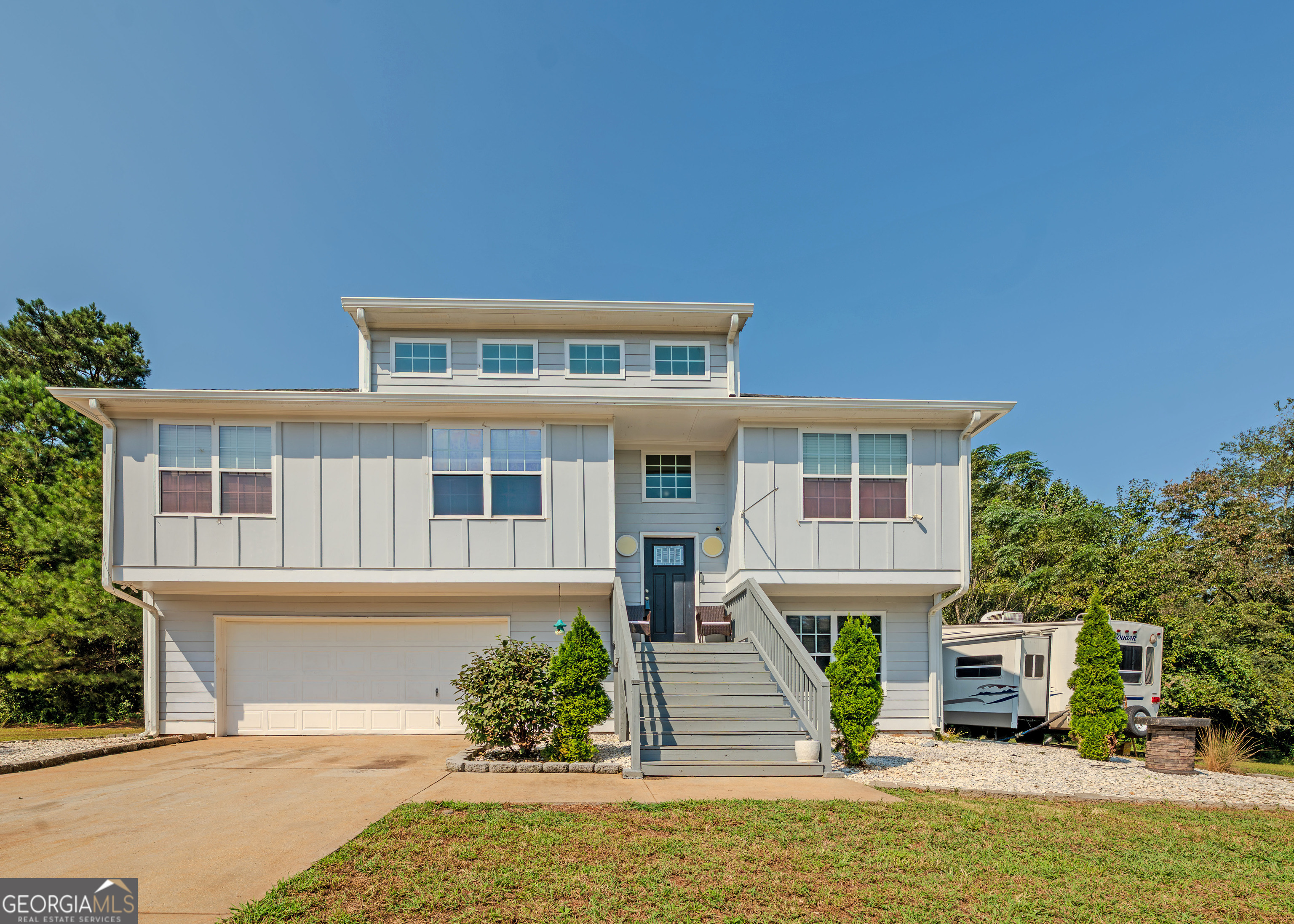 87 Little Milltown Road Hartwell, GA 30643 - Photo 1 of 39 a front view of a house with a garden