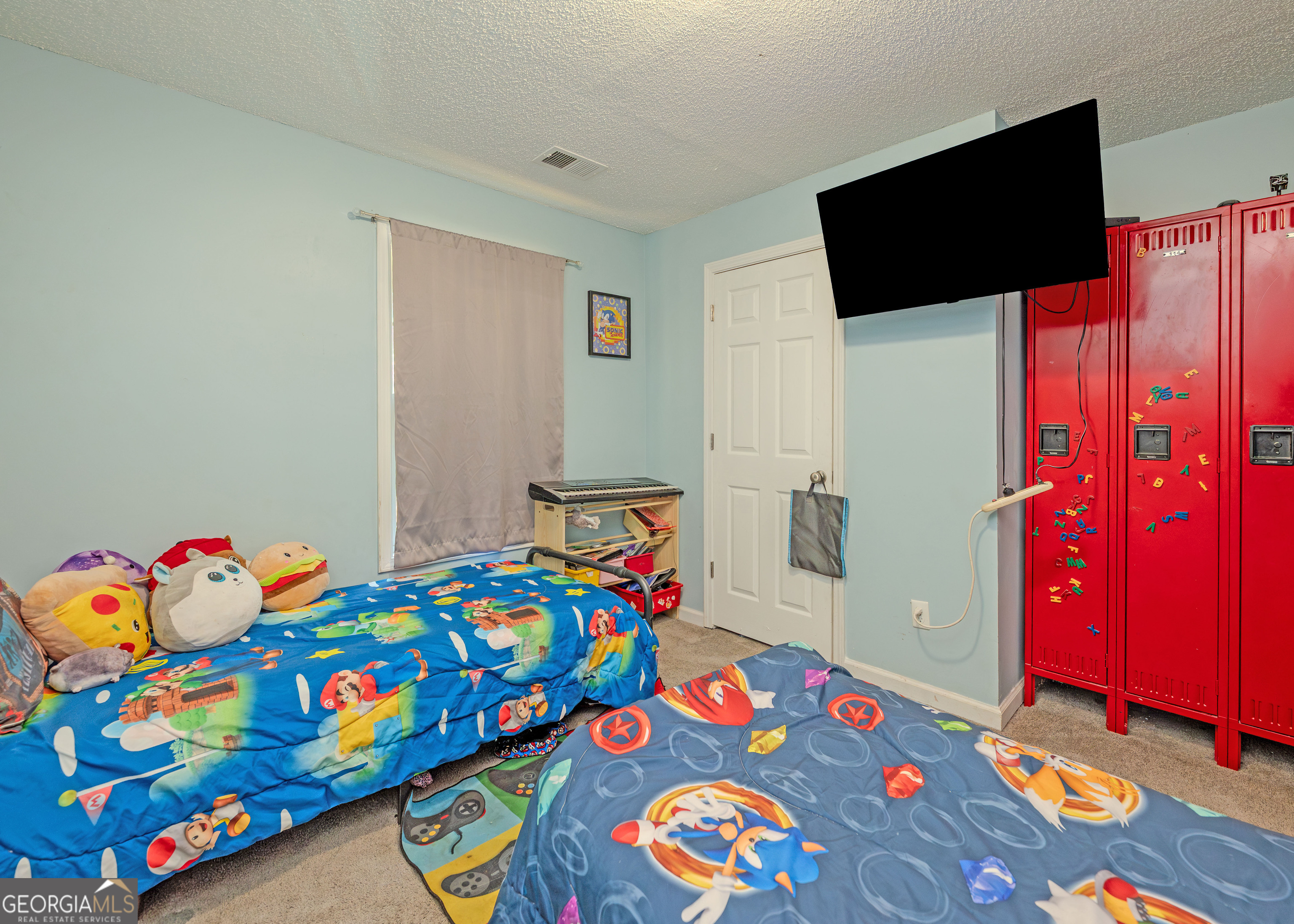 87 Little Milltown Road Hartwell, GA 30643 - Photo 20 of 39 a bedroom with a bed and a tv in it