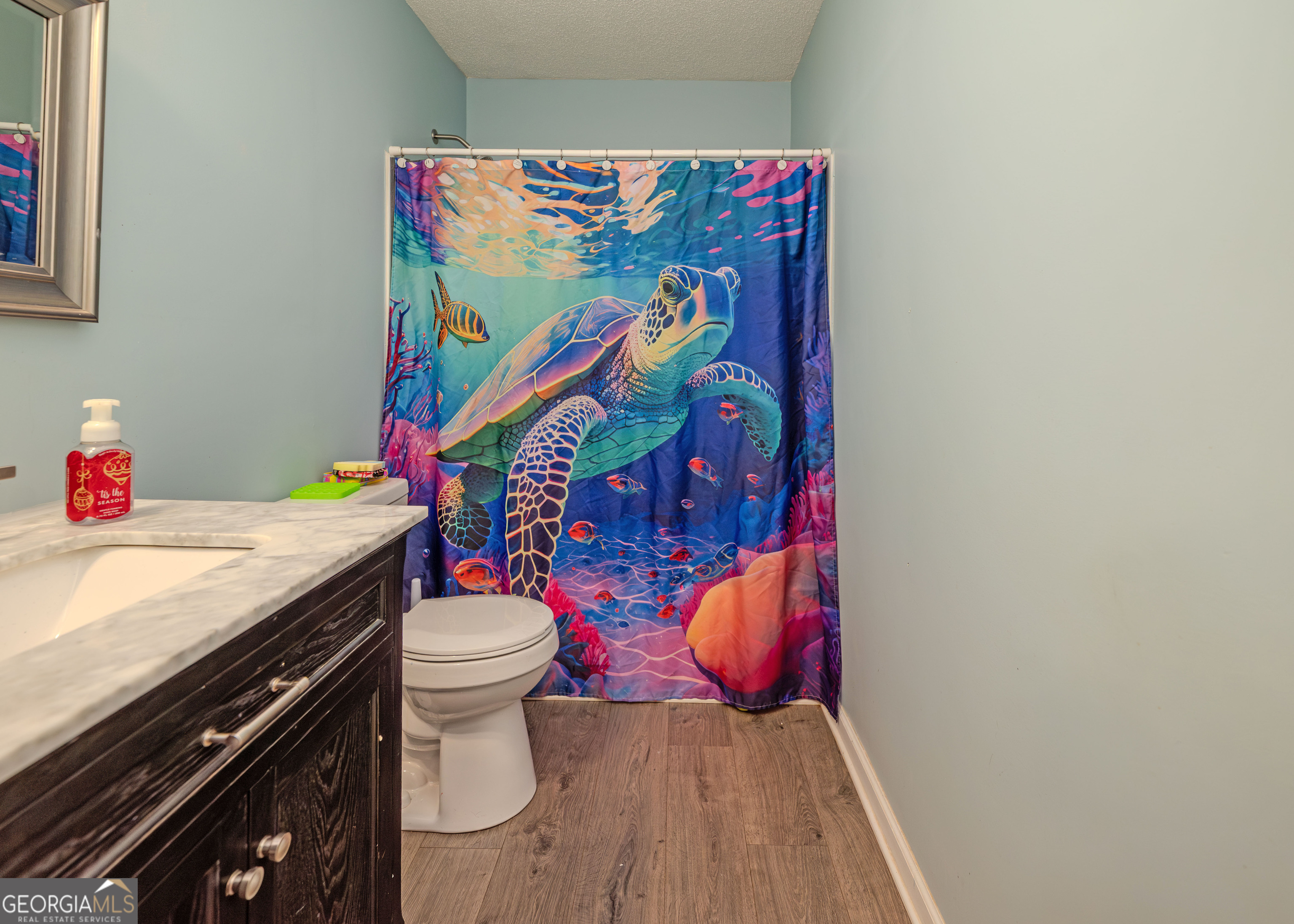 87 Little Milltown Road Hartwell, GA 30643 - Photo 32 of 39 a bathroom with a granite countertop toilet and a sink