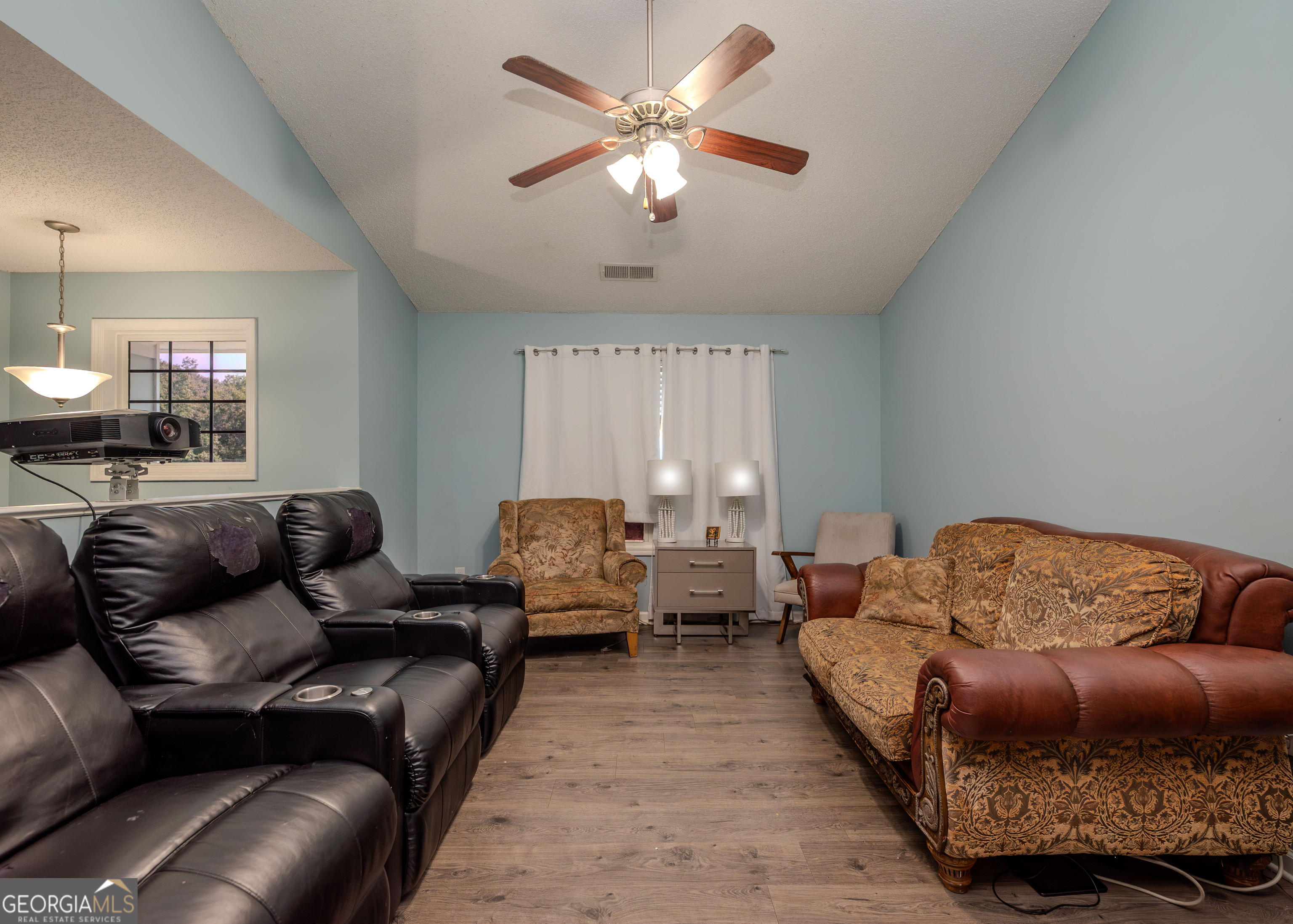87 Little Milltown Road Hartwell, GA 30643 - Photo 10 of 39 a living room with furniture and a ceiling fan