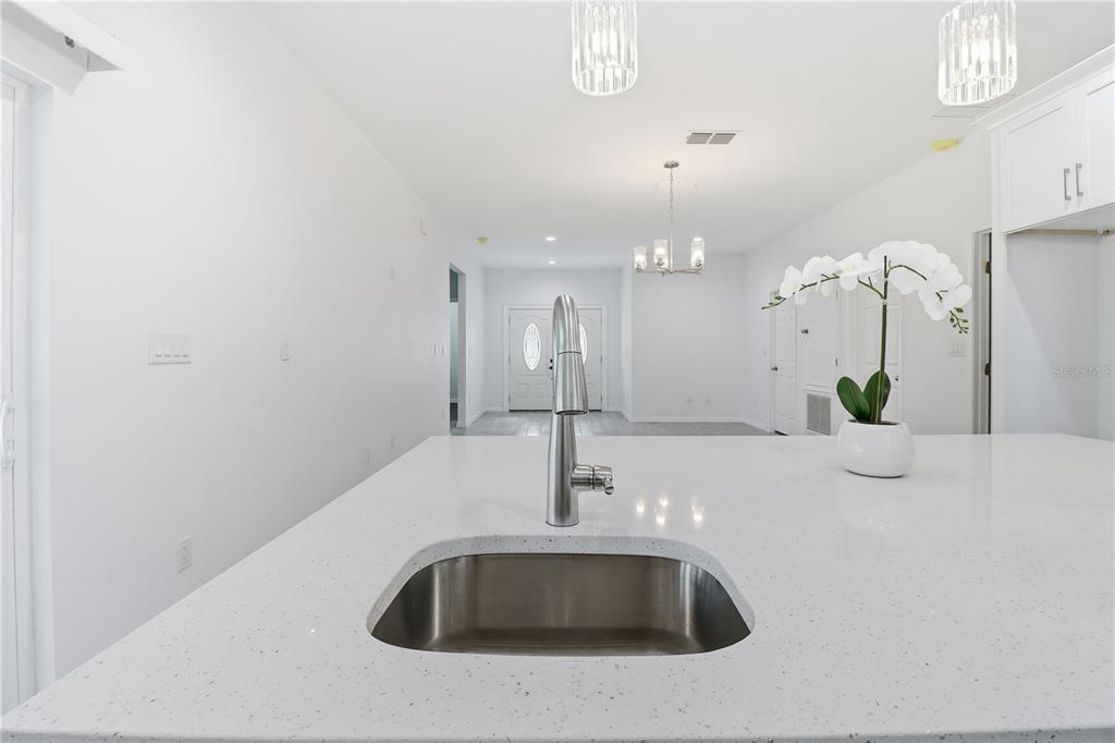 822 Poplar Street Inverness, FL 34452 - Photo 13 of 45 a close view of a sink and kitchen island