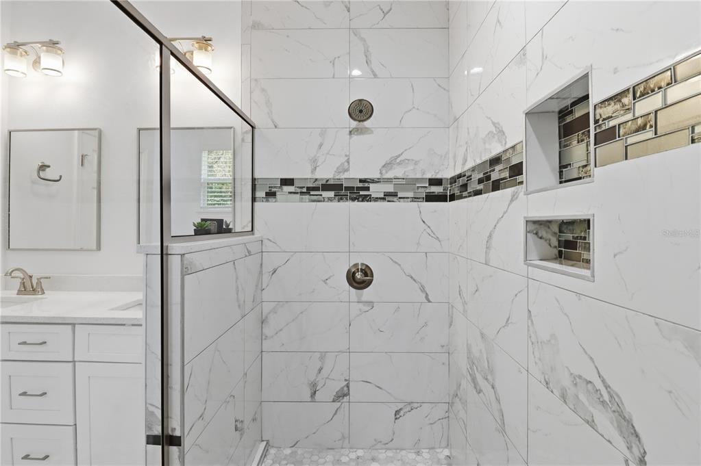 822 Poplar Street Inverness, FL 34452 - Photo 19 of 45 a bathroom with shower