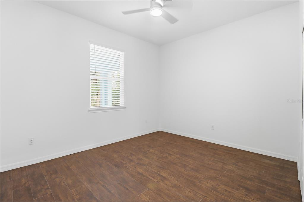 822 Poplar Street Inverness, FL 34452 - Photo 23 of 45 an empty room with a window