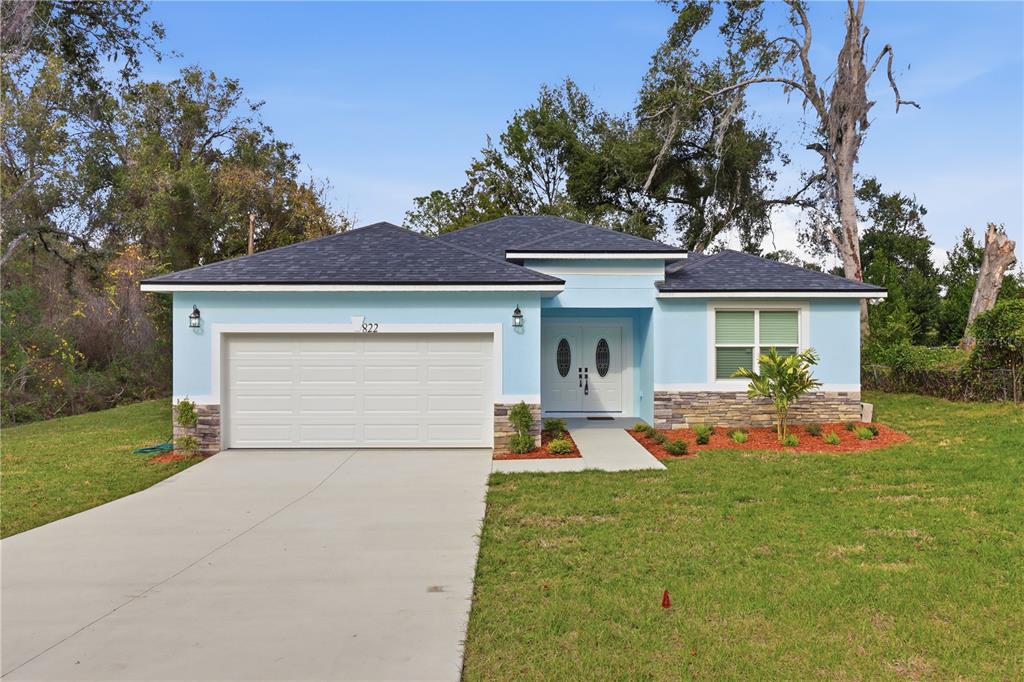 822 Poplar Street Inverness, FL 34452 - Photo 32 of 45 a front view of a house with swing and porch