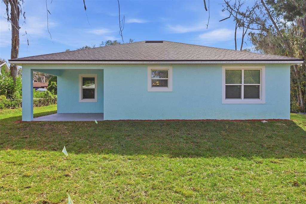 822 Poplar Street Inverness, FL 34452 - Photo 34 of 45 a front view of a house with garden