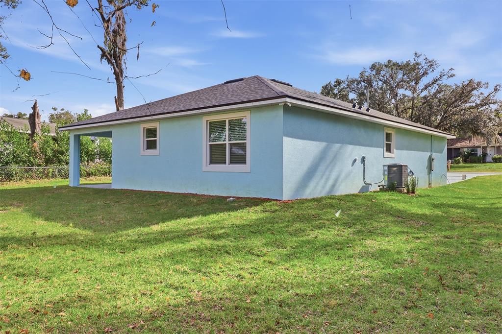 822 Poplar Street Inverness, FL 34452 - Photo 36 of 45 a front view of house with yard and green space