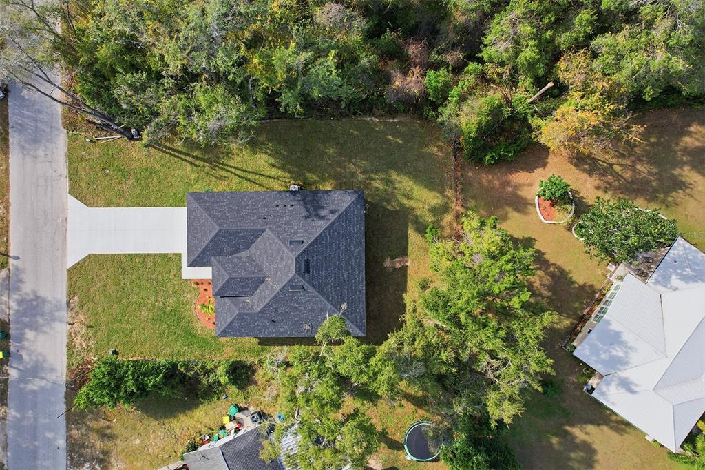 822 Poplar Street Inverness, FL 34452 - Photo 37 of 45 an aerial view of a house with a yard swimming pool and outdoor seating