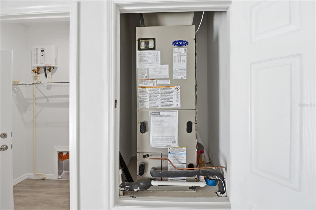 822 Poplar Street Inverness, FL 34452 - Photo 39 of 45 a view of hall way with mirror and furniture