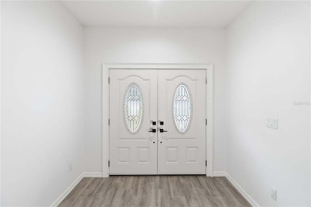 822 Poplar Street Inverness, FL 34452 - Photo 4 of 45 a view of entryway with wooden floor