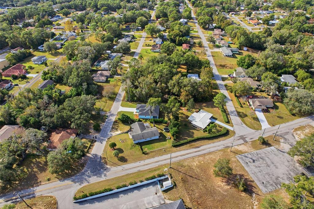 822 Poplar Street Inverness, FL 34452 - Photo 44 of 45 an aerial view of a house with a yard and lake view