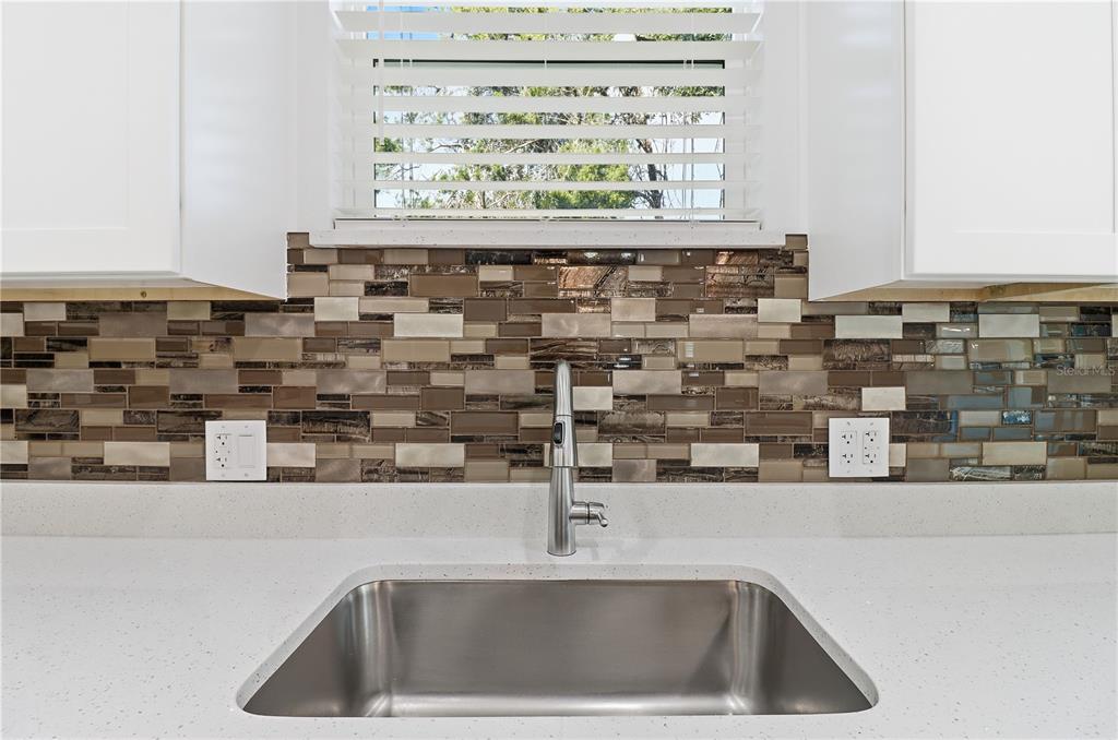 822 Poplar Street Inverness, FL 34452 - Photo 9 of 45 a close view of sink and a mirror