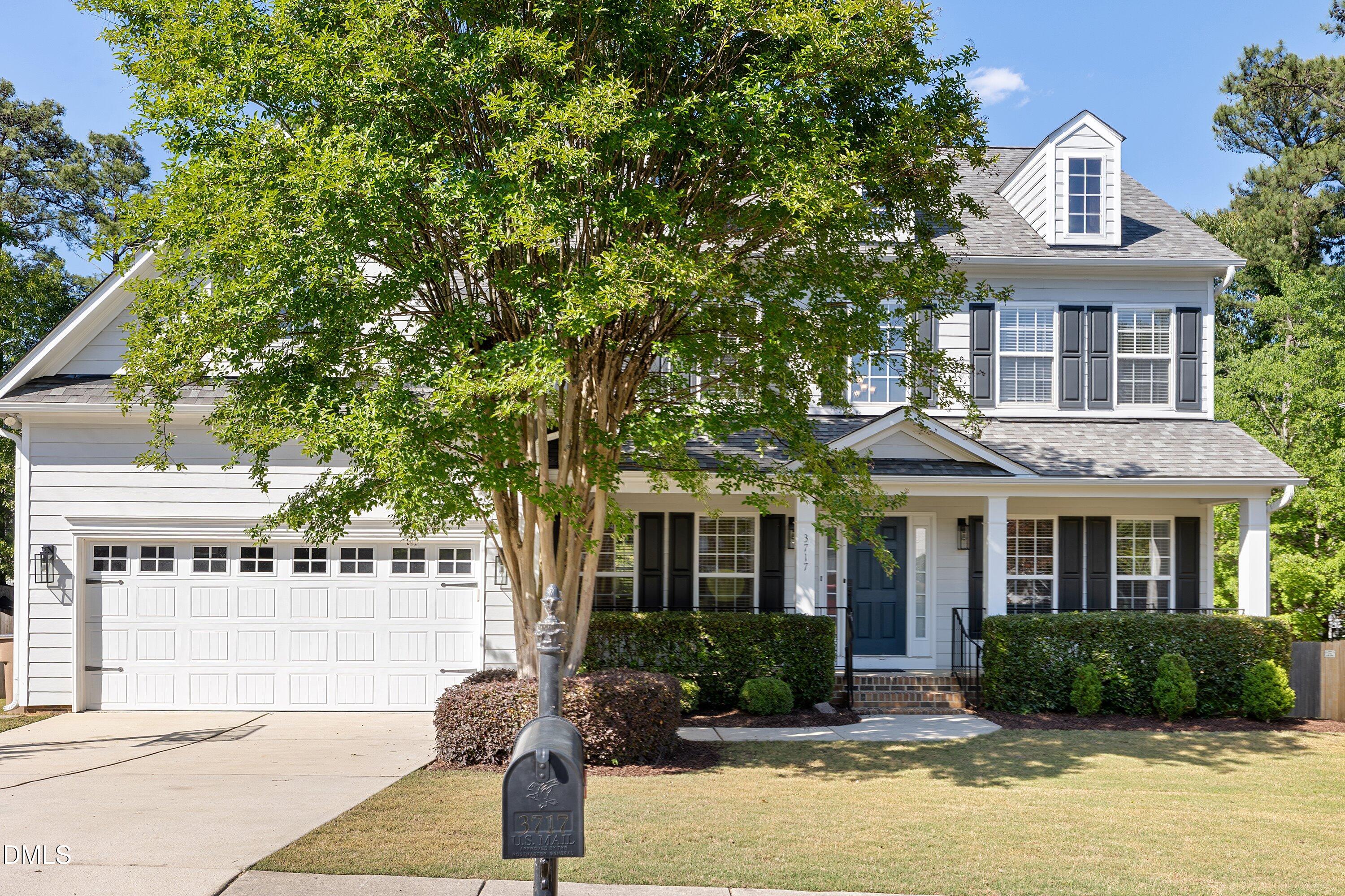 3717 Windmeade Road Wake Forest, NC 27587 - Photo 2 of 51 a front view of a house with garden