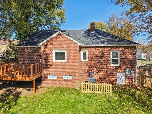a front view of a house with a yard table and chairs