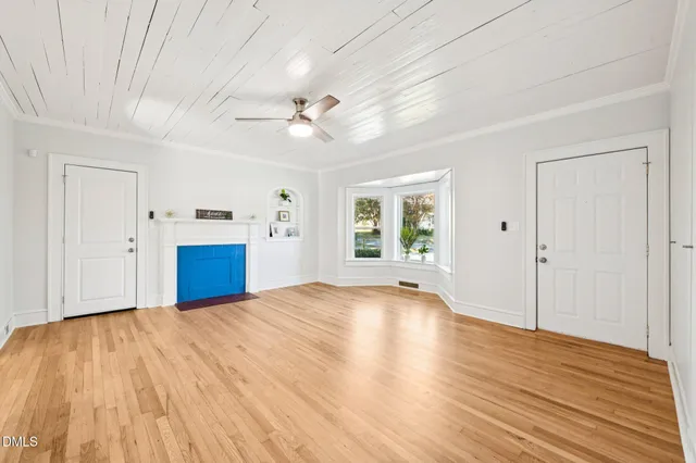 a view of an entryway with wooden floor and garden