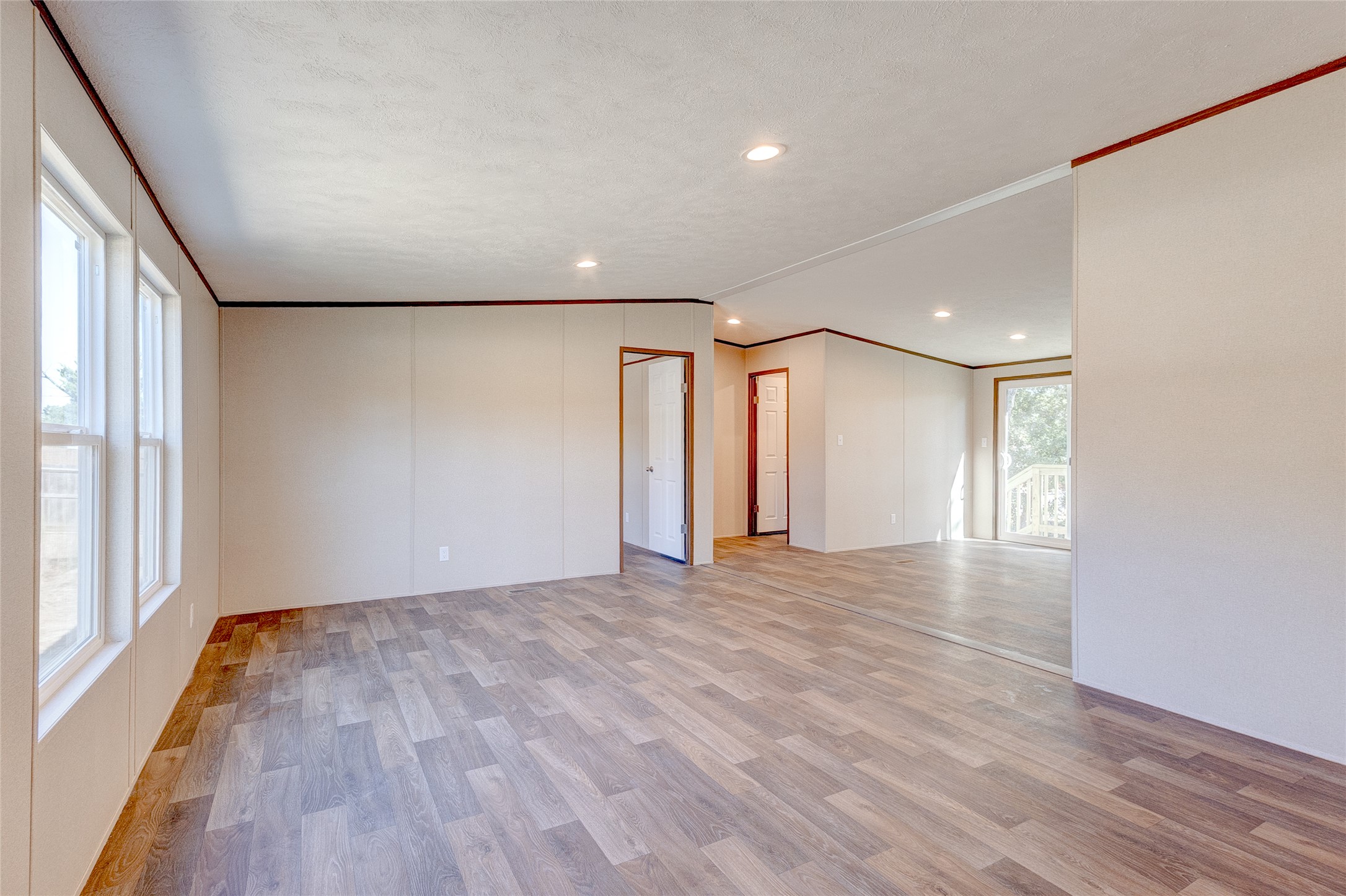 107 Los Cueva Road Elgin, TX 78621 - Photo 29 of 31 Unfurnished room featuring ornamental molding, light wood-style flooring, and recessed lighting