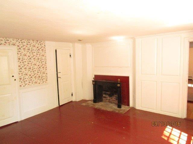 46 Main Street Brewster, MA 02631 - Photo 16 of 19 a view of empty room with a fireplace