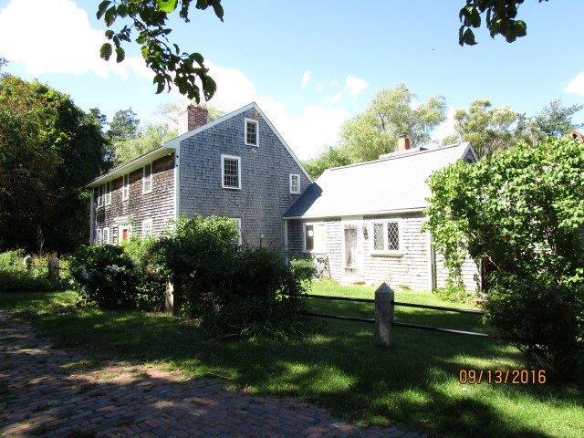 46 Main Street Brewster, MA 02631 - Photo 2 of 19 a front view of a house with garden