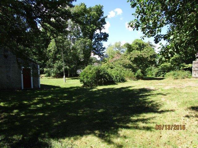 46 Main Street Brewster, MA 02631 - Photo 3 of 19 a view of outdoor space with deck and green space