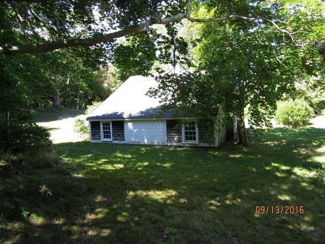 46 Main Street Brewster, MA 02631 - Photo 4 of 19 a front view of a house with yard