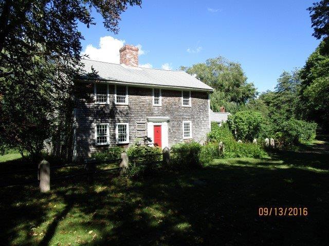 46 Main Street Brewster, MA 02631 - Photo 5 of 19 a front view of a house with a garden